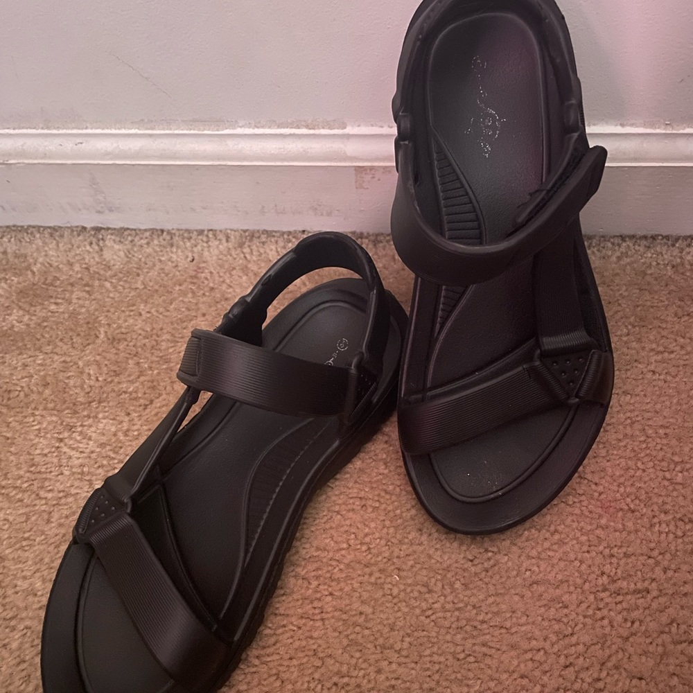 Black strapped sandals. Never worn. Sandals are all black